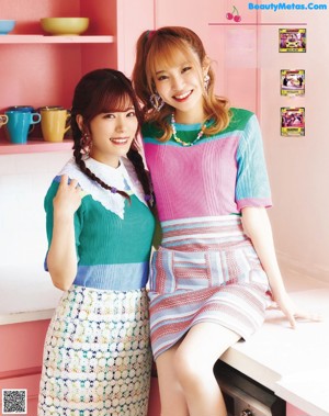 A magazine page with a picture of two girls posing for a picture.