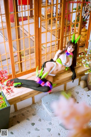 A woman in a bunny costume posing for a picture.
