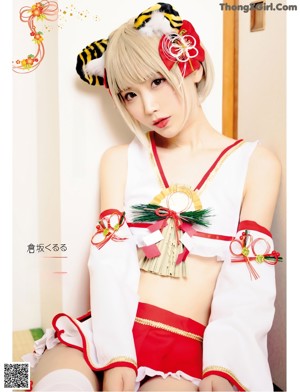 A woman in a reindeer costume sitting on a chair.