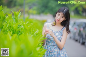 A woman in a school uniform posing for a picture.