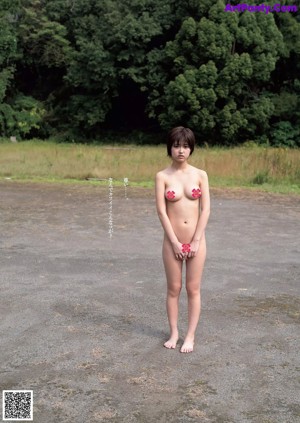 A woman with short brown hair is posing for a picture.